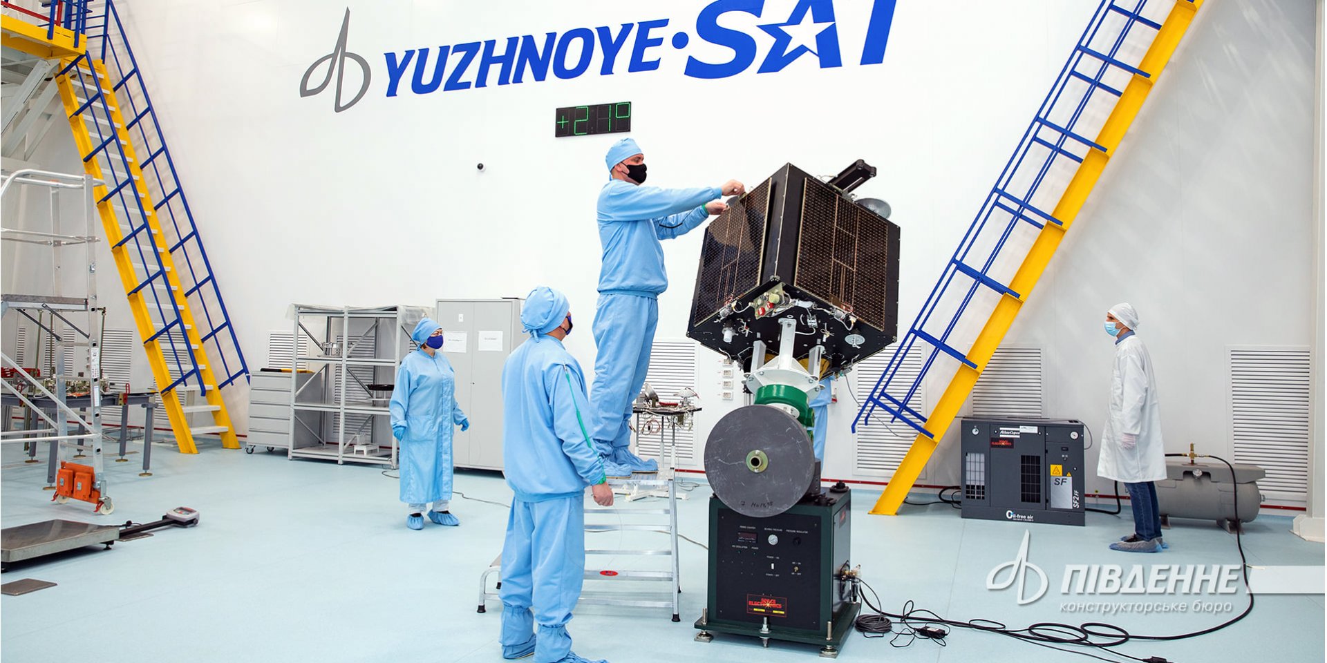 Workers examine Ukrainian satellite Sich-2-30 (Photo: Yuzhnoye State Design Office / Facebook)
