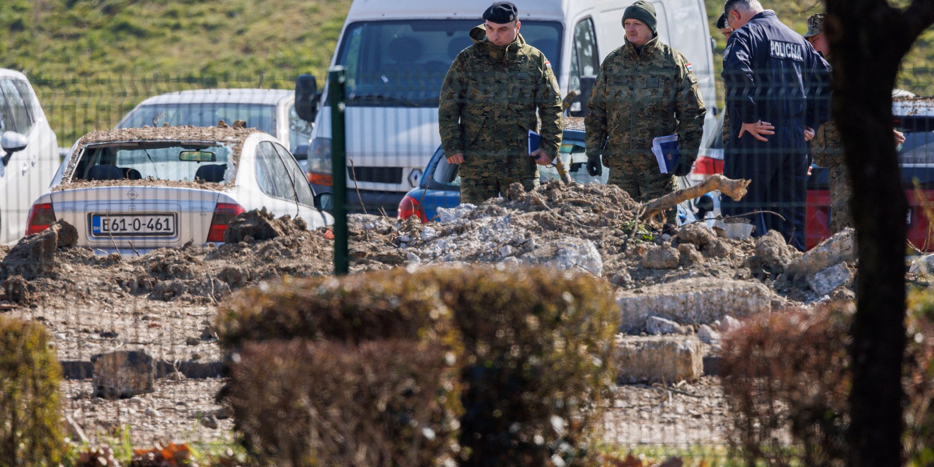 Croatian servicemen and police officers inspect an area where the drone crashed on March 11 (Photo: REUTERS/Antonio Bronic)