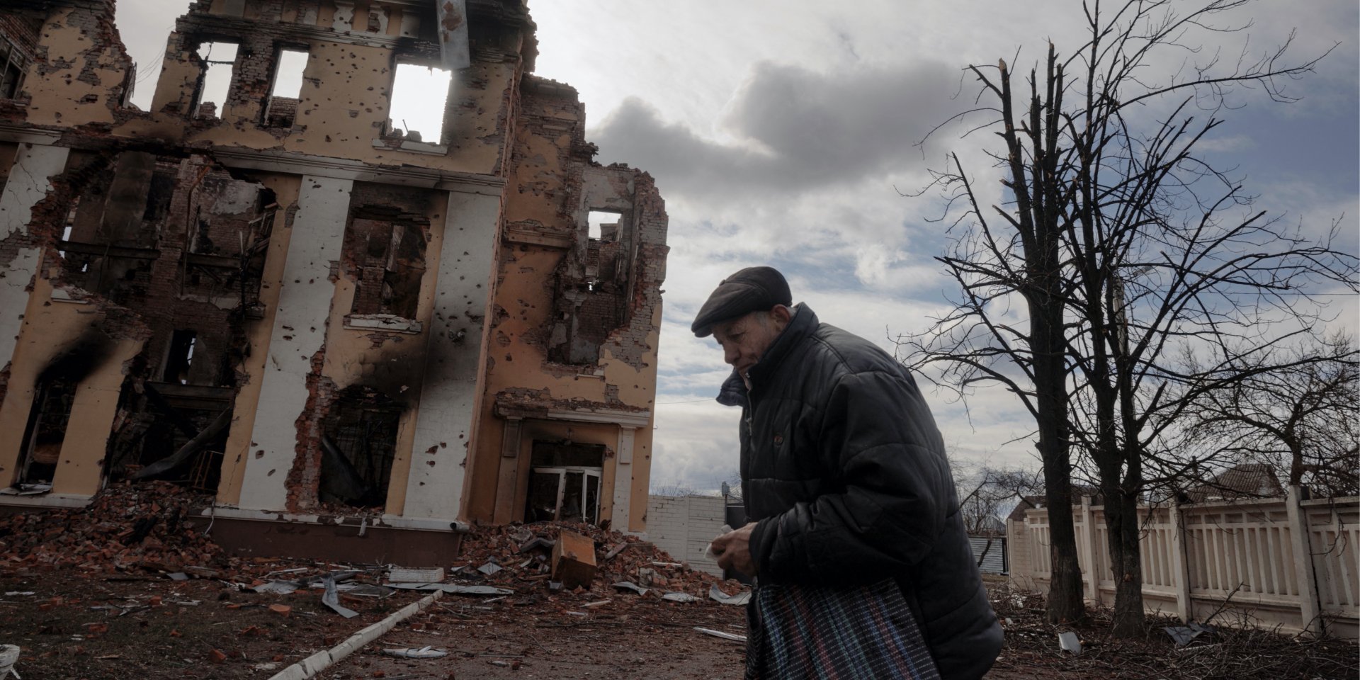A man walks by a school in Kharkiv destroyed by Russian shelling. (Photo: REUTERS/Thomas Peter)