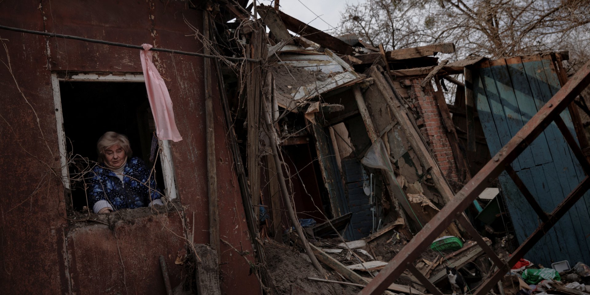 A woman pictured in her house, which was destroyed by Russian shelling in Kharkiv. (Photo: REUTERS/Thomas Peter)