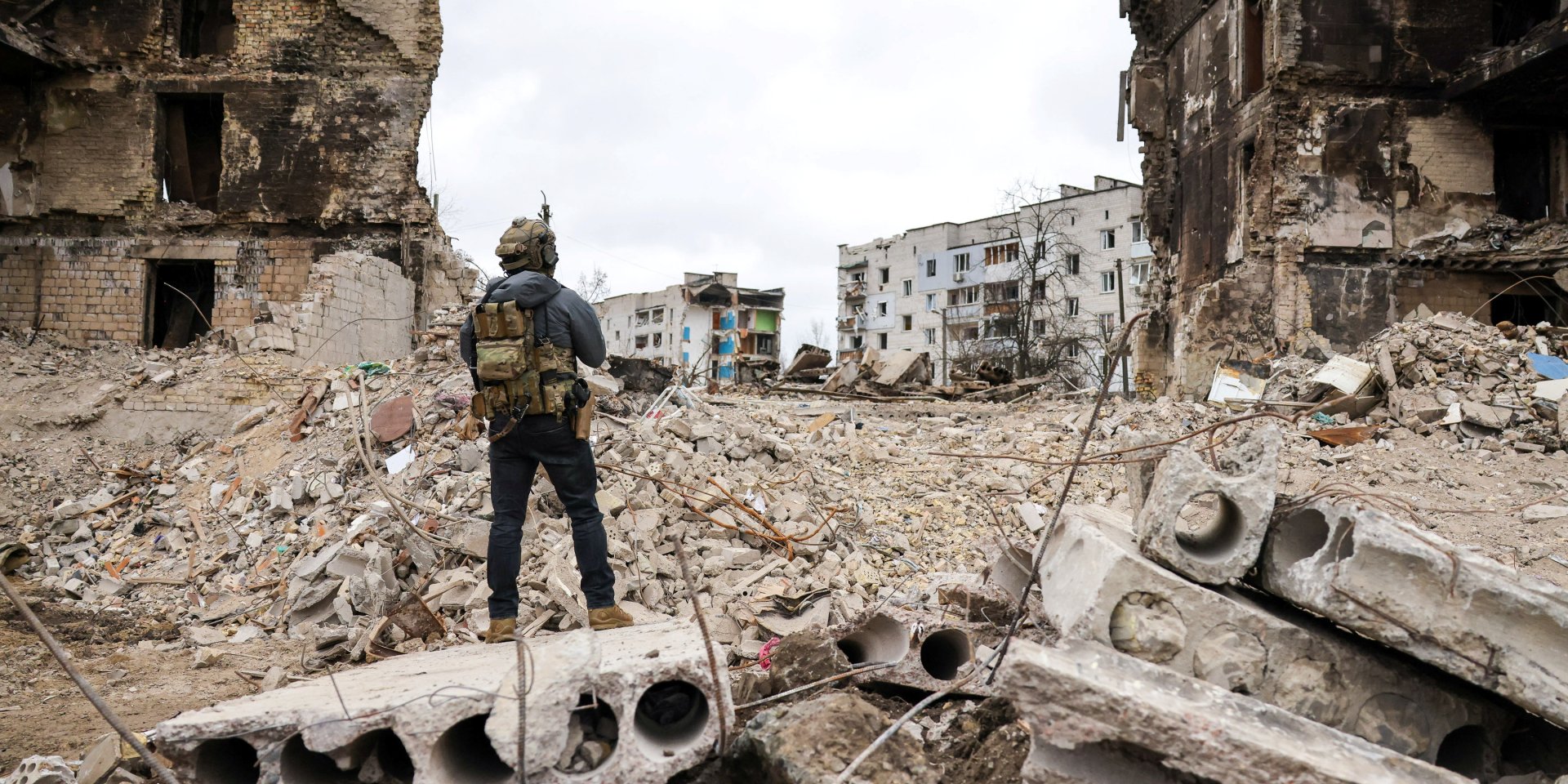 A man stands in front of destroyed houses during the visit of Polish President Andrzej Duda to the village of Borodyanka, Kyiv Oblast, on April 13. (Photo: Polish Presidency/Handout via REUTERS)