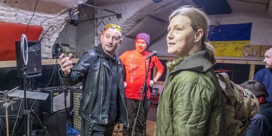 Veterans Affairs Minister Yulia Laputina and writer and musician Serhiy Zhadan at a charity concert in a Kharkiv basement. (Photo: Oleksandr Medvedev)