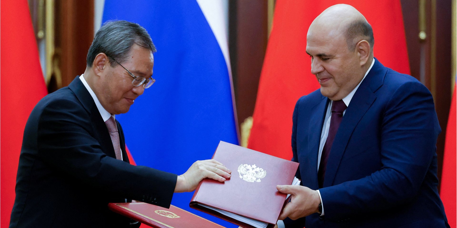 Лі Цян і Михайло Мішустін (Фото: Sputnik/Dmitry Astakhov/Pool via REUTERS)