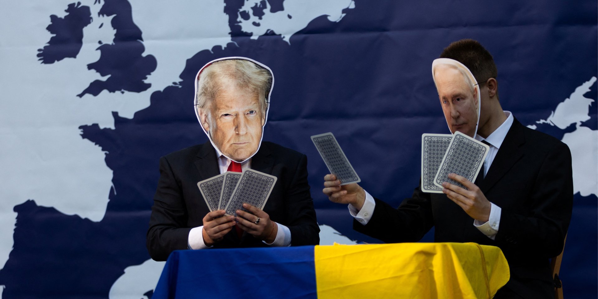 Demostrators wear card board masks depicting U.S. President Donald Trump and Russian President Vladimir Putin as people attend an anti Trump protest called 