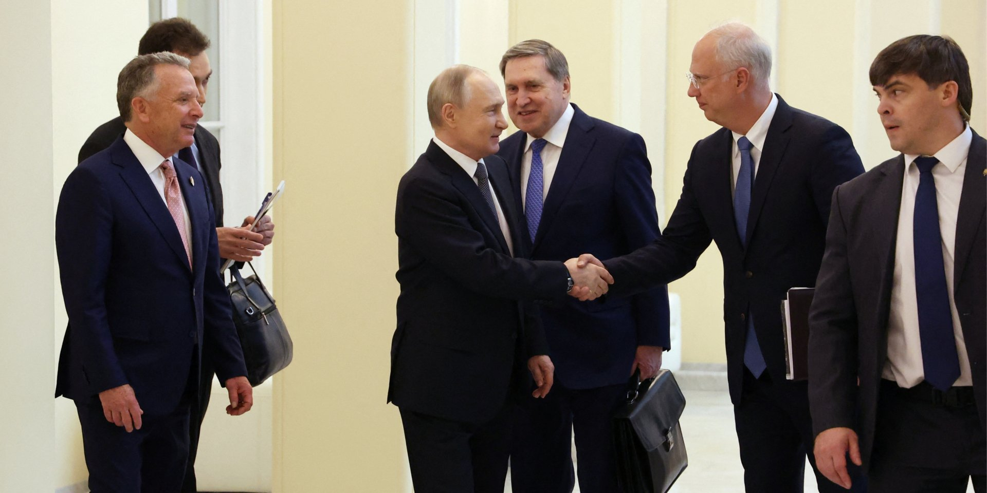 Vladimir Putin shakes hands with his special envoy Kirill Dmitriev as U.S. President Donald Trump’s special envoy, Steve Witkoff, stands nearby. St. Petersburg, April 11, 2025. (Photo: Sputnik/Vyacheslav Prokofyev/Pool via REUTERS)