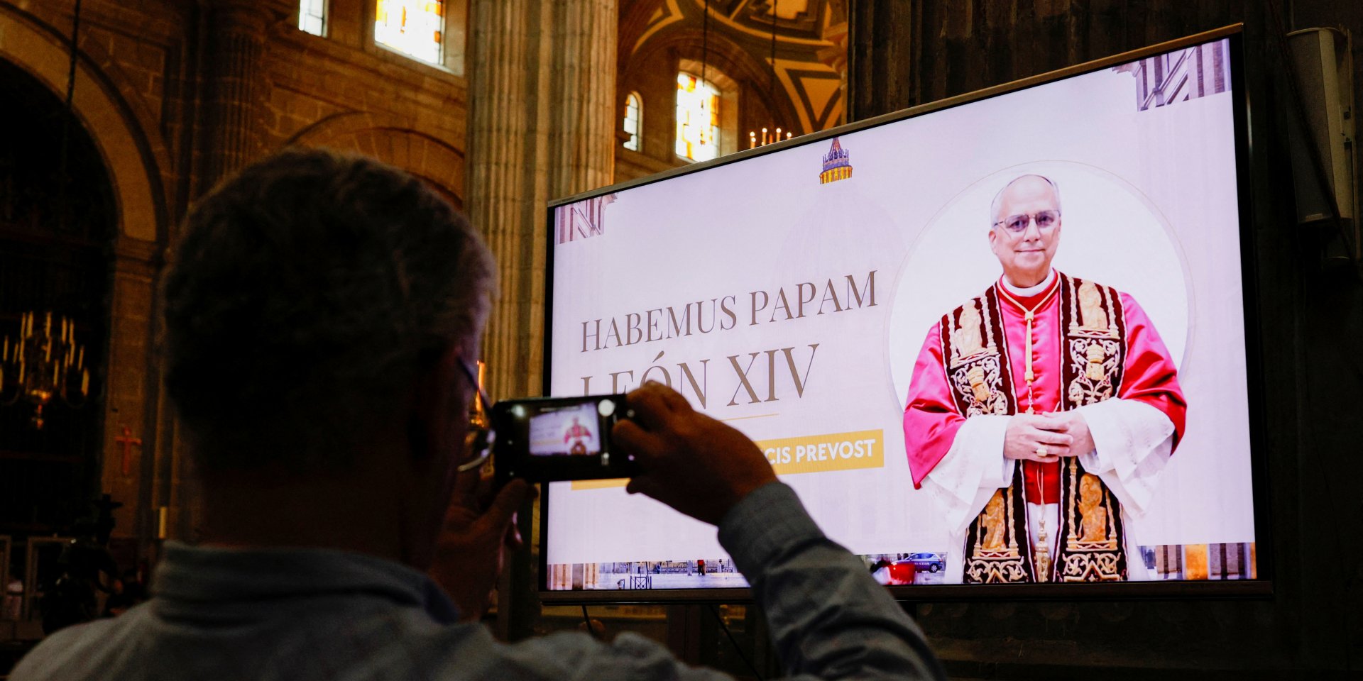 A faithful holds their phone after Mass at the Metropolitan Cathedral, where an image of the Pope was shown on screen after Cardinal Robert Prevost of the United States was announced as Pope Leo XIV, at Zocalo Square in Mexico City, Mexico, May 8, 2025. (Photo: REUTERS/Henry Romero)