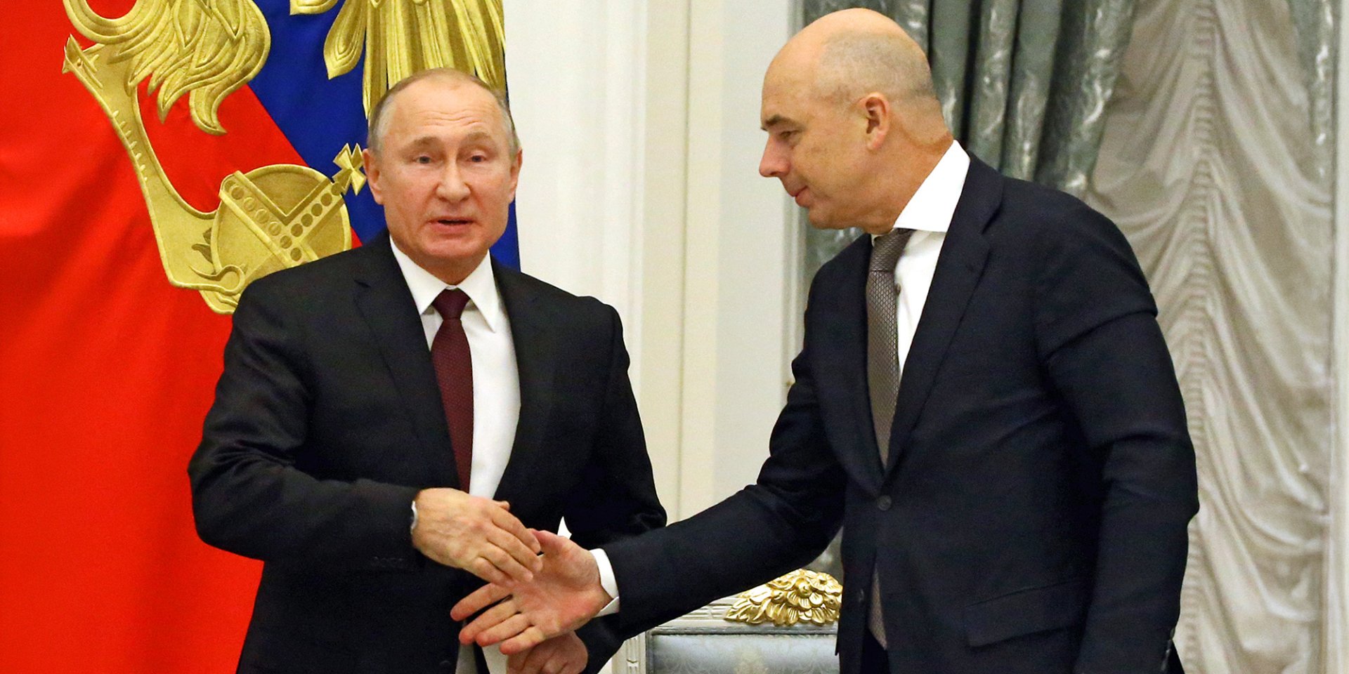 Російський диктатор Володимир Путін та міністр фінансів РФ Антон Сілуанов (Фото: Getty Images)