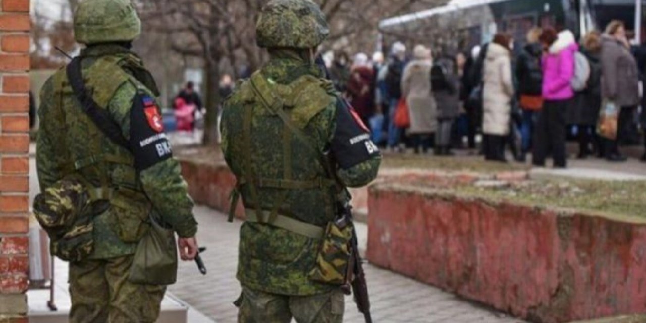 Russian soldiers patrol a street in occupied Melitopol. Under military occupation, local journalists documenting daily life have faced arrests, disappearances, and long prison sentences. (Photo: mlt.gov.ua)
