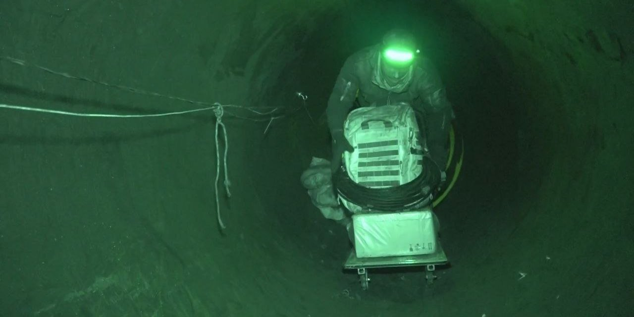 Russain soldier in the pipe near Sudzha, Kursk Oblast, March 2025 (Photo: Два майора / Telegram)