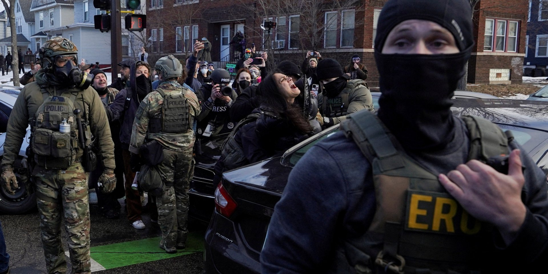 Masked federal agents in Minneapolis (Photo: REUTERS/Ryan Murphy)