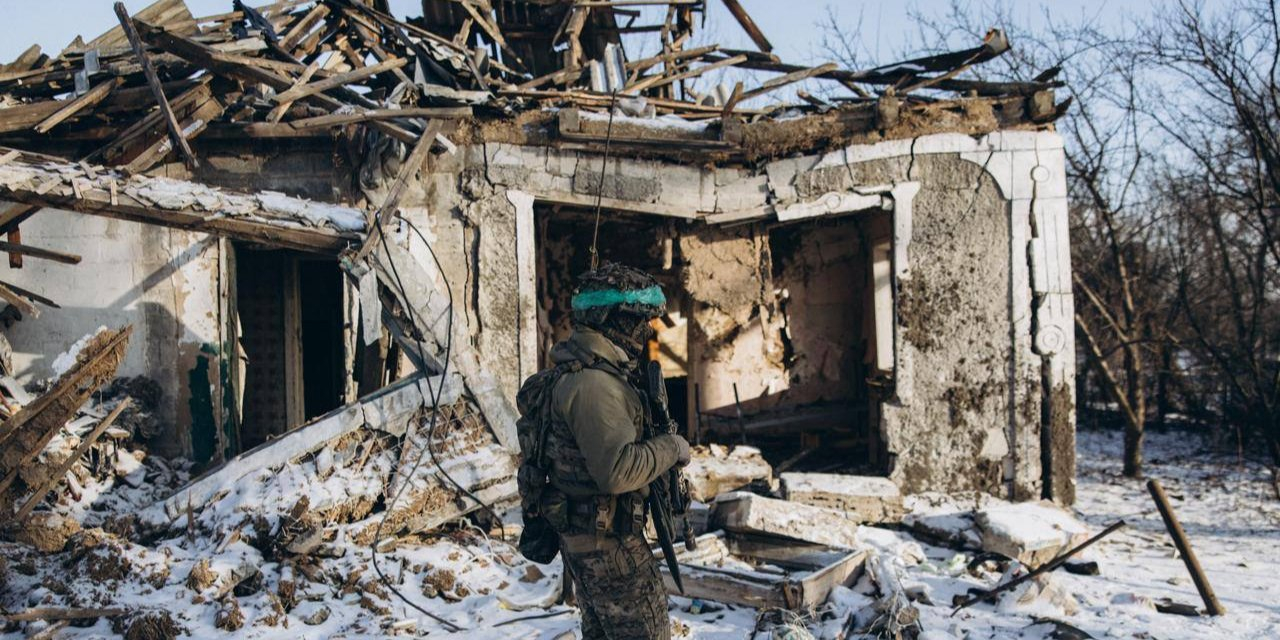 A soldier from the Rubizh brigade walks past a house destroyed by Russian strikes in the Pokrovsk sector. (Photo: Rubizh Brigade / Telegram)