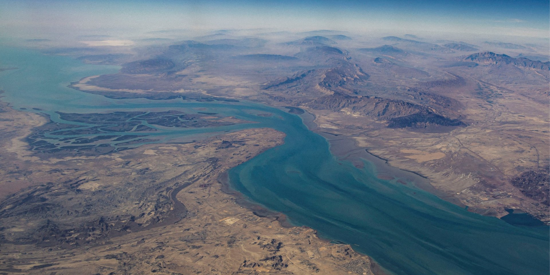 Pictured is the Iranian island of Qeshm, the largest island in the Strait of Hormuz and the eastern Persian Gulf. The Clarence Strait, visible in the photo, separates it from the mainland (Photo: REUTERS/Stringer/File Photo)