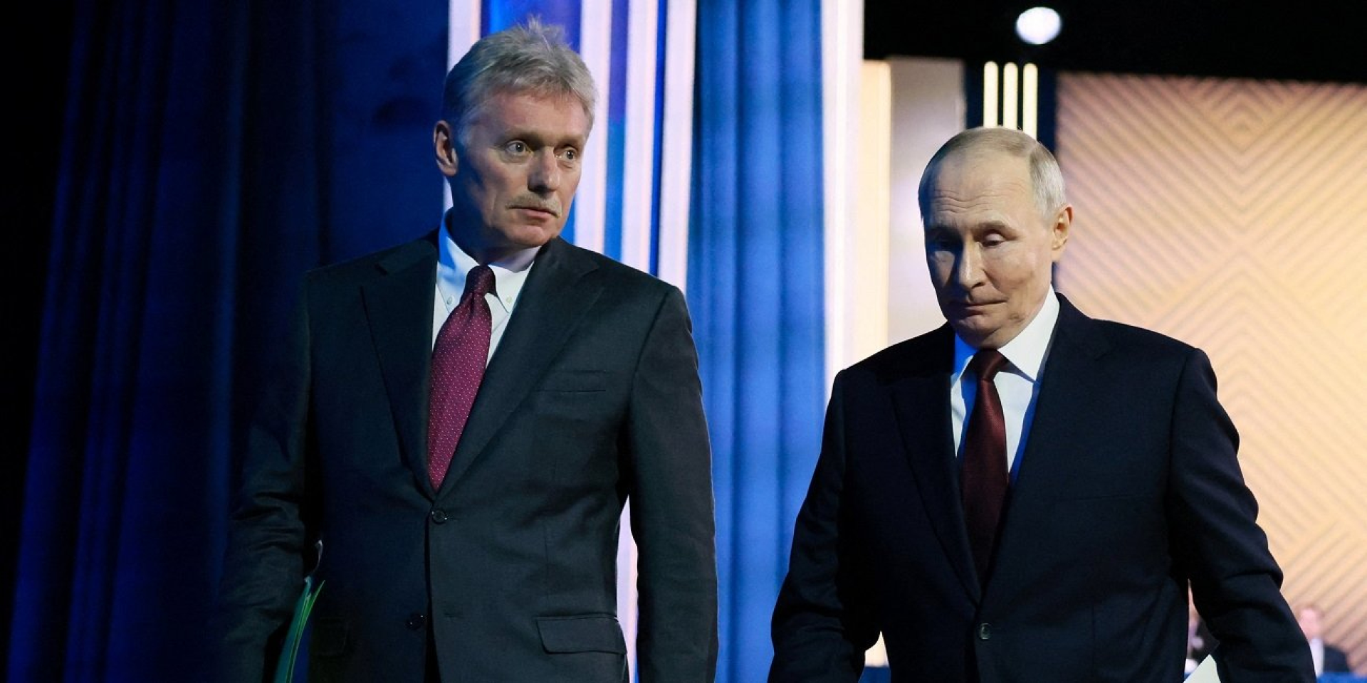 Kremlin spokesperson Dmitry Peskov and Russian dictator Vladimir Putin leave the building after the direct line event on Dec. 19, 2025 (Photo: Sputnik/Mikhail Metzel/Pool via REUTERS)