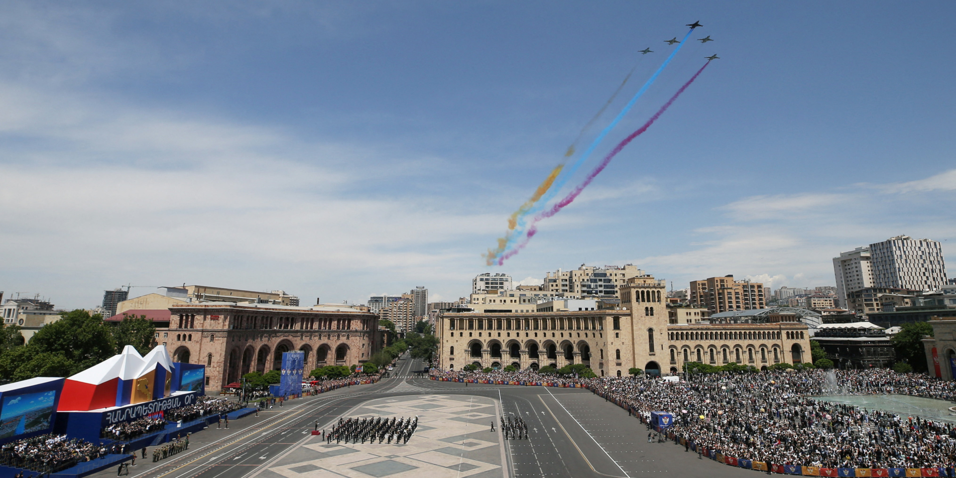 Fighter jets release smoke in the colors of the Armenian flag during a military parade marking Republic Day in Yerevan. (Photo: Vahram Baghdasaryan/Photolure via REUTERS)