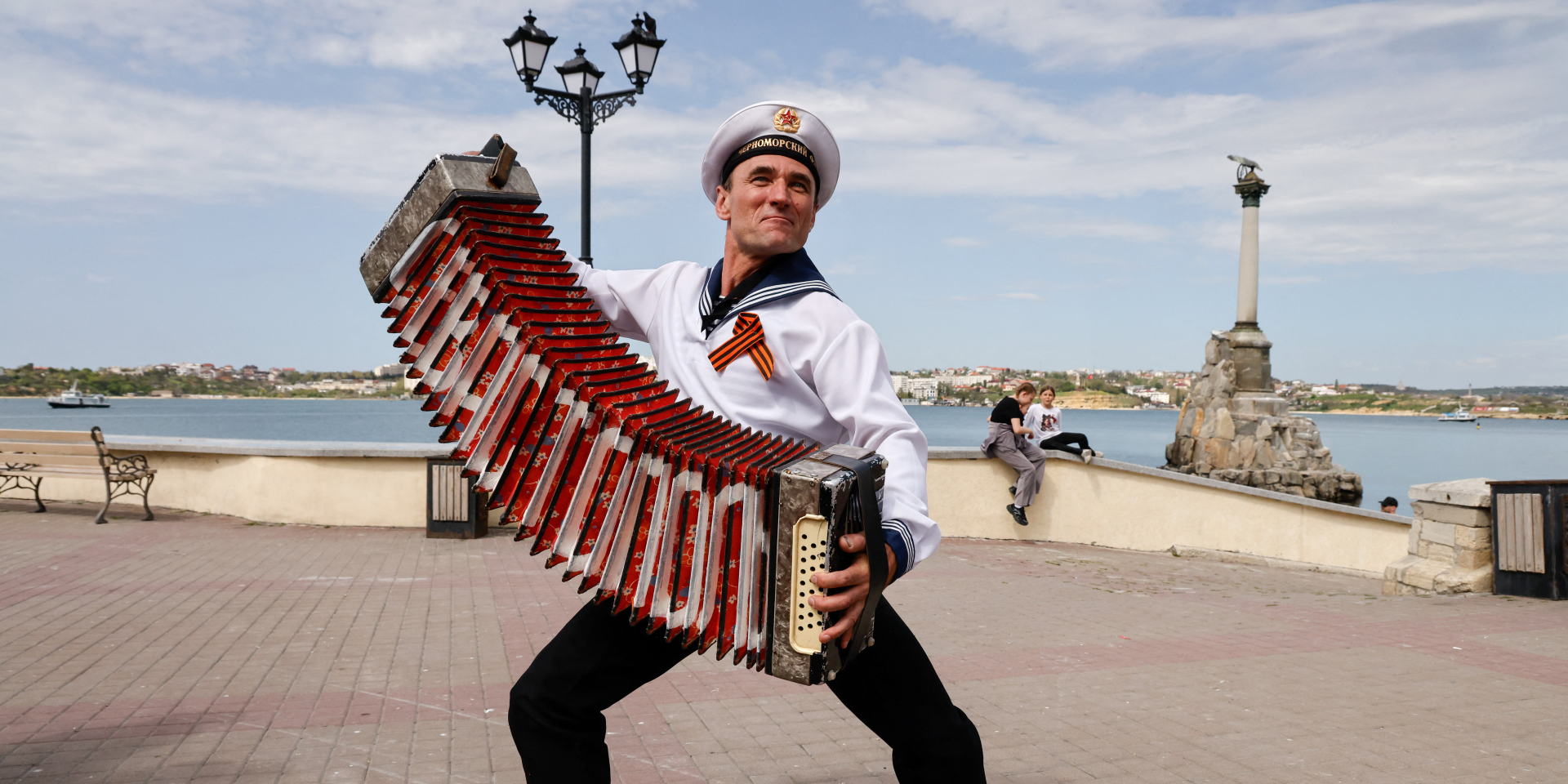 A man plays an accordion in Sevastopol, Crimea, on May 9, 2026. (Photo: REUTERS/Alexey Pavlishak)