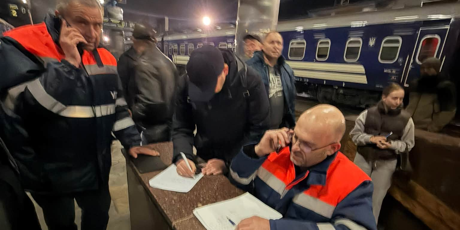 Ukrzaliznytsia workers at Dnipro railway station overnight on Oct. 30 (Photo: Oleksandr Pertsovskyi / Facebook)