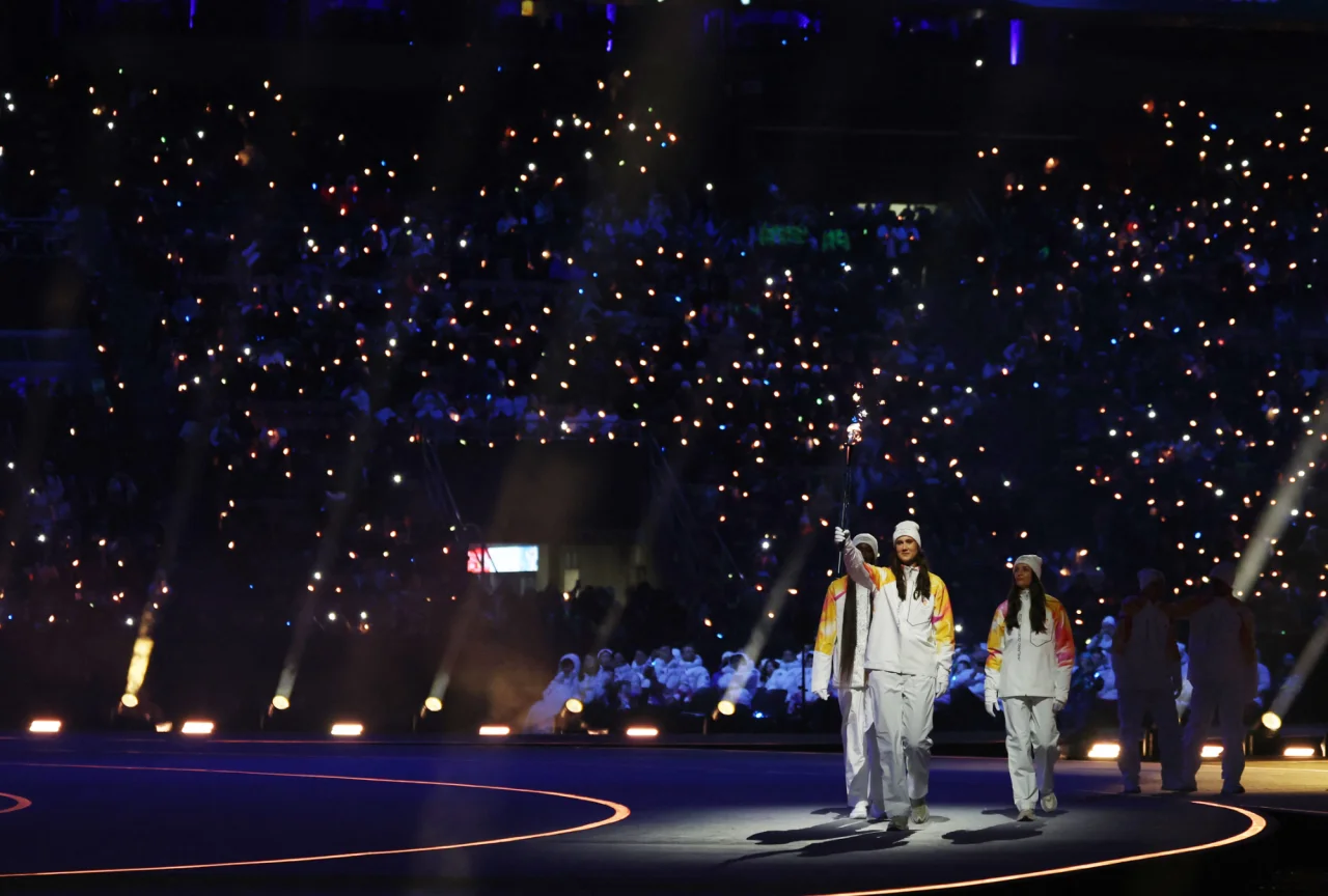Олімпійський вогонь на Сан-Сіро (Фото: REUTERS/Yves Herman)